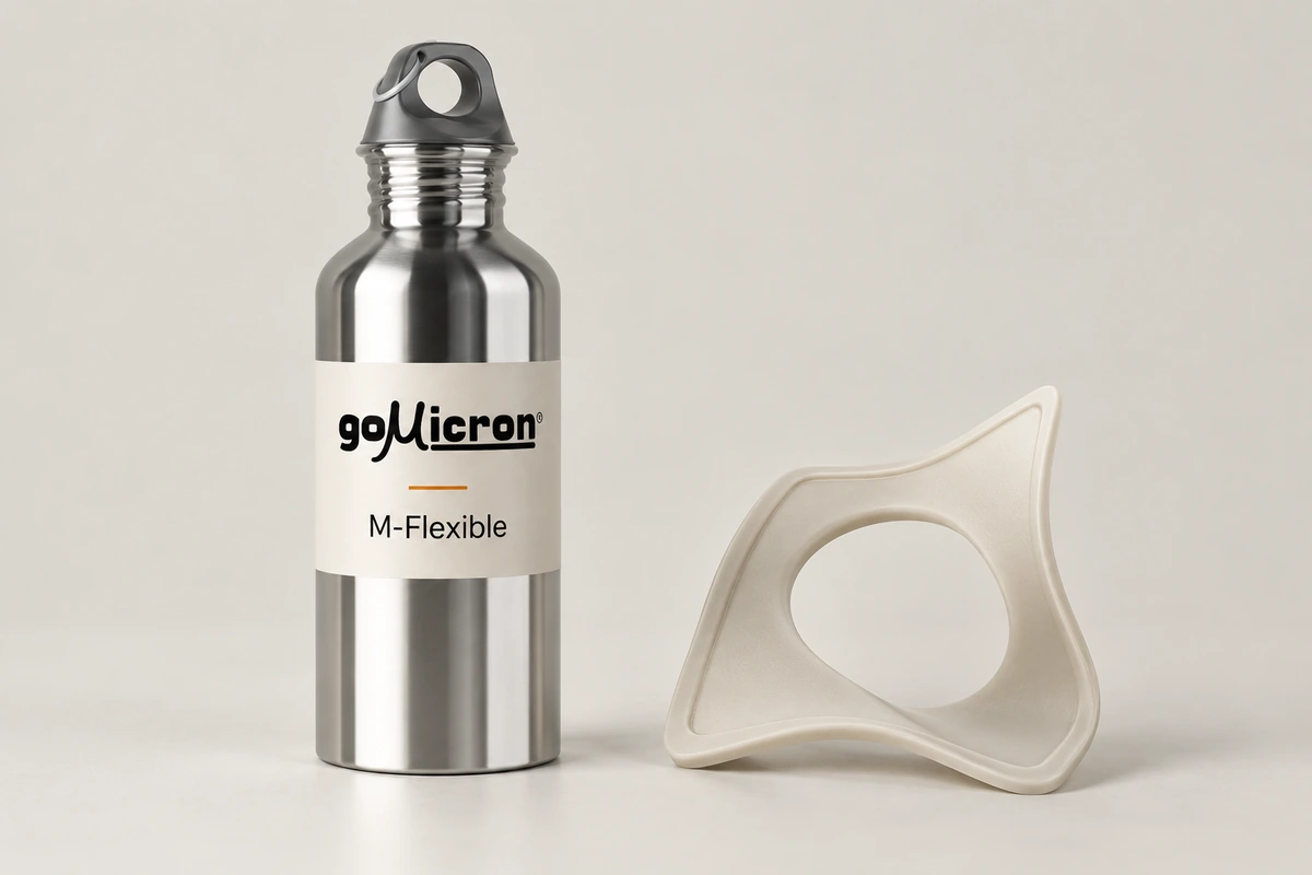 M-Flexible resin bottle beside a visibly bent ivory sample with a circular opening